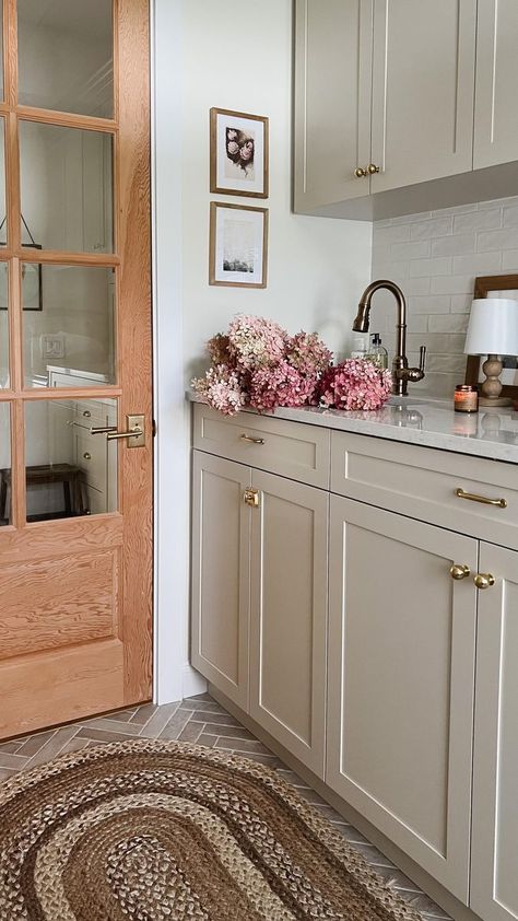 38K views · 6.7K reactions | Laundry / Mudroom Details: Flooring: tribeca Sand 2” x 10” @centuratile Backsplash: Mallorca White Glossy 3″ × 8″ @centuratile Cabinet Colour: Natural Cream @benjaminmoore Faucet @deltafaucetcan Rug @rugs_usa Pantry Door: from A1 doors. Currently unstained ☺️ | Amy E Peters | Home Decor | Father John Misty · Real Love Baby Cream Colored Kitchen Cabinets, Mudroom Paint Color, Cream Kitchen Cabinets, Greige Kitchen, Florida Kitchen, Laundry Mudroom, Mudroom Cabinets, Earthy Home Decor, Laundry Room Flooring