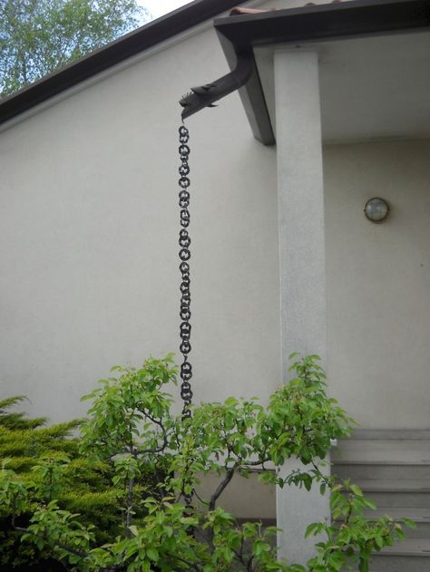 Rain chain gutters house Italy ; Gardenista Downspouts Ideas Creative, Rain Chain Downspout, Chain Rain Gutters, Rain Chains Gutter Downspout Ideas, Rain Chain Basin Ideas, Drain Pipe Ideas, Drain Chain, Gutter Chains, Pool Pergola