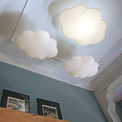 A whimsical cloud lampshade that softly diffuses light and makes you feel like you're falling asleep under a perfect Pixar sky. ☁️ �☁️ ☁️ Cloud Hanging From Ceiling, Ceiling Light Nursery, Cloud Lampshade, Groovy Interiors, Library Renovation, Hanging Cloud, Cloud Ceiling, Ceiling Lampshade, Hanging Clouds