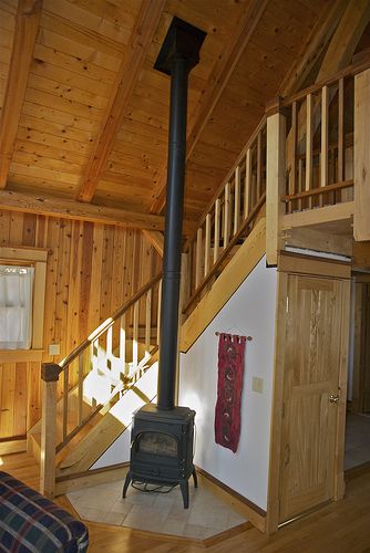 Wood, wood and wood-burner - can be done with immaculate planning !! Wood Stove Tall Ceiling, Wood Stove Cathedral Ceiling, Wood Stove By Stairs, Wood Stove On Bus Vent Three Window, 14x40 Wood Stove Room, Tiny Home Wood Burning Stove, Wood Stove Wall Woodland Direct, Cabin Stairs, Rustic Staircase