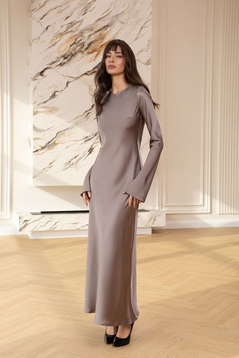 Experience the grandeur of royalty with the Alexa Mocco Satin Long Sleeve Maxi Dress. This exquisite gown features a luxurious satin finish and a majestic maxi length, complemented by elegant long sleeves that offer a truly regal presence at any formal affair.  #eveningdress #dress #dresses #stylish #dresslover #womenwear #maxidress #moccodress #longsleeve #satindress #weddingdress Elegant Silk Dresses, Satin Silk Dress, Satin Dresses Long Sleeve, Exquisite Gowns, Classic Outfit, Silk Dress Long, Satin Long Sleeve, Muslim Fashion Outfits, Satin Maxi