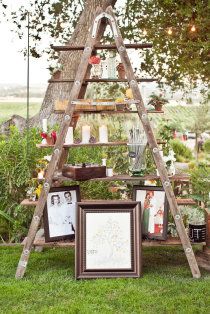 You can also use the ladder for a dessert table or tie ribbon onto escort cards and hang them from the rungs. If you use the ladder for a display of family photos, engagement pictures, pictures that tell your story together or the desserts, just secure boards to the ladder with screws so that they won't fall or tip over. Ladder Wedding, Backyard Wedding Decorations, Diy Outdoor Weddings, Old Ladder, Boda Diy, Rustic Backyard, Wedding Reception Ideas, Rustic Outdoor Wedding, Personal Celebration