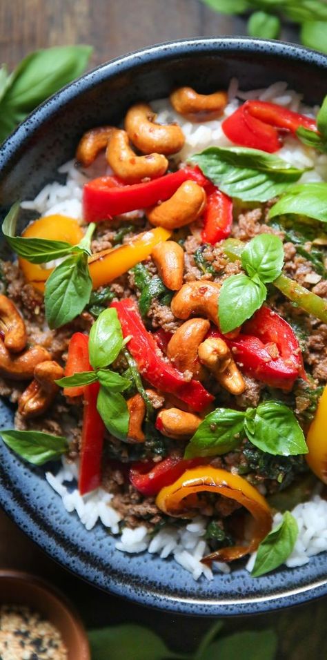 Thai Basil Beef is a quick and easy weeknight dinner that comes together in just 30 minutes and you only need one pan (wok or a skillet)! It is cheaper, faster, and tastier than a take-out! #thai #beef #easy #entree #cashews #basil Thai Beef Stir Fry, Basil Beef, Chicken Bakes, Simple Weeknight Meals, Thai Basil Beef, Thai Beef, Budget Friendly Dinner, Asian Recipe, Cast Iron Recipes