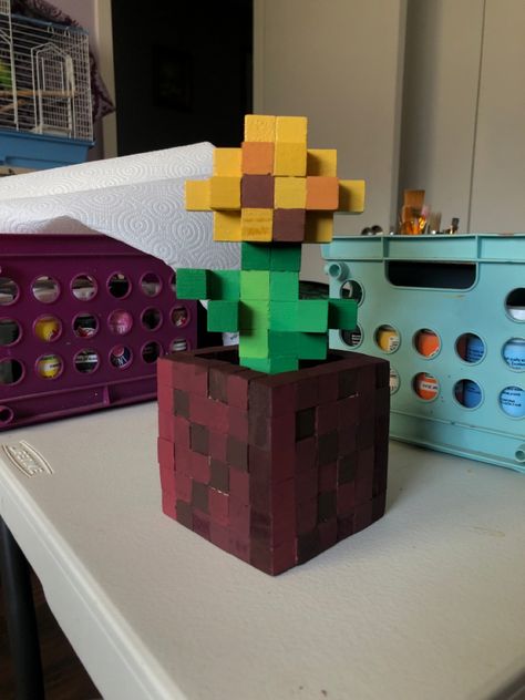 I made it out of mini wooden cubes. Glued them together and painted them to look just like from the game! Minecraft Wooden Cube Diy, Wooden Cubes Ideas, Minecraft Wooden Cube Art, Wooden Cubes Craft, Cube Craft, Minecraft Cube Art, Minecraft Wooden Block Crafts, Minecraft Flowers Wooden Blocks, Wooden Cube Crafts