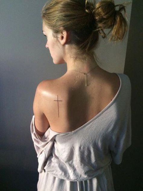 Fine lined cross tattoo on the back | www.otziapp.com Blade Tattoo, Dragons Tattoo, Cross Tattoos For Women, Tattoo Back, Cross Tattoos, Cross Tattoo Designs, Small Tattoos Simple, Tattoos Women, Back Tattoo Women