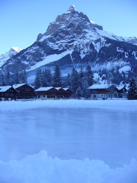 Outdoor skating rink in Kandersteg. Ice Skating Background, Ice Skating Rink Aesthetic, Ice Rink Aesthetic, Skating Place, Ice Skating Rink Outdoor, Outdoor Ice Rink, Aesthetic Christmas Ice Skating, Outdoor Ice Rink Aesthetic, Ice Skating Place Background