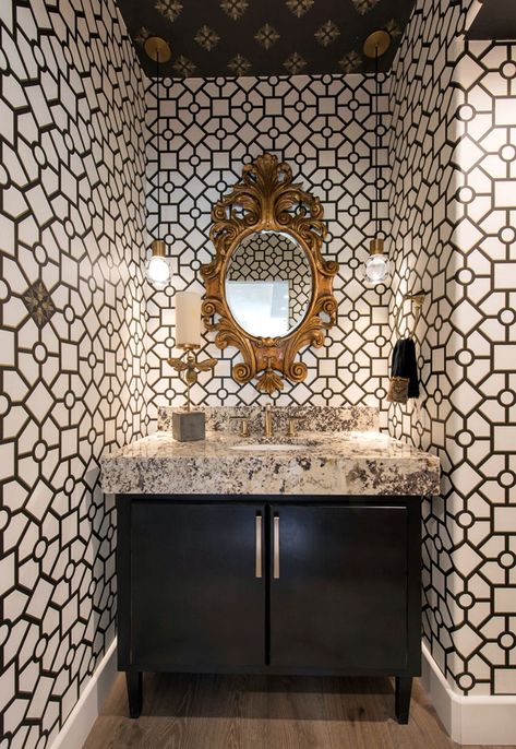 Juxtaposition is key in this Scottsdale, Arizona, powder room, which features a 17th-century Baroque reproduction mirror surrounded by contemporary fixtures and hardware. The geometric pattern of the wallpaper and gold finishes throughout add their own touches of boldness to the tableau. Black Interiors, Wallpaper 2022, Powder Room Wallpaper, Urban Electric, Green Velvet Sofa, Scottsdale Arizona, Room Wallpaper, Black Interior, 17th Century