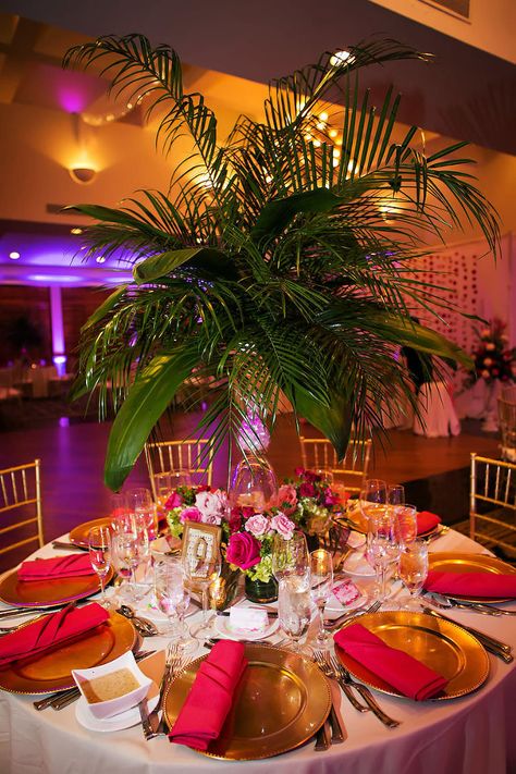 Tall Tropical Palm Leaf Wedding Centerpieces with Pink and Green Flowers | Gold Plate Charger with Pink Napkins and Gold Chiavari Chairs | Lilly Pulitzer Inspired Wedding Décor | Sarasota Wedding Photography by Limelight Photography Caribbean Wedding Theme, Palm Leaf Wedding, Havana Nights Theme, Tropical Garden Party, Tropical Wedding Centerpieces, Tropical Wedding Reception, Havana Nights Party, Tropical Centerpieces, Pink Green Wedding