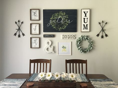 2 Arrow Sconces, 3 Herb Signs, Black Coffee & Tea Sign, Whitewashed Ampersand, Whitewashed Herbs Cutout, Framed Lemons Watercolor, Dark Blue Gather Sign (wall centerpiece), Yum Sign, Lamb’s Ear Wreath. All items purchased from Hobby Lobby🙌🏻 Used craft paper and painters tape to set layout and then hang. Super easy! Kitchen Dinning Room Wall Decor, Ampersand Decor Ideas, Diy Eat Sign, Kitchen Decorating Ideas Wall Art, Dining Room Decor For Walls, Small Dining Room Wall Art, Kitchen Wall Decor Ideas Above Table, Black Kitchen Wall Decor, Hobby Lobby Farmhouse Wall Decor