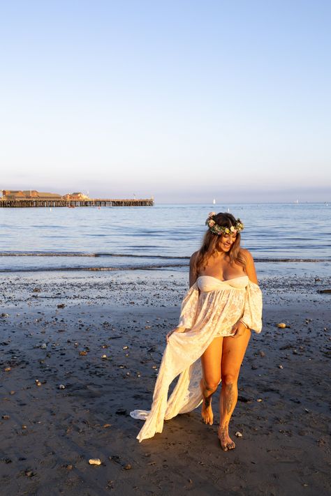 Maternity shoot with a glowing mother-to-be in a bohemian-style dress and flower crown, framed by sunset light on a California beach. Pictures On Beach, Hippie Pregnancy, Ethereal Dresses, Sunset Light, Bohemian Style Dresses, Beach Maternity, California Beach, On Beach, Maternity Shoot