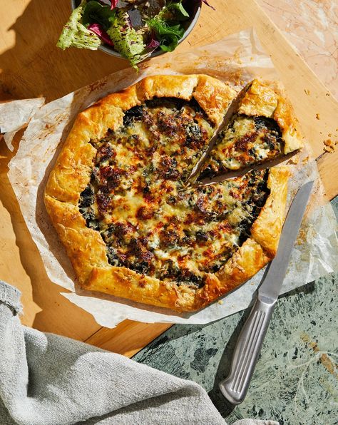 Onion galette recipe by Danielle Alvarez. | House & Garden Onion Galette, Savoury Pastry, Comforting Recipes, Pastry Dishes, Comte Cheese, Slow Roast Lamb, Galette Recipe, Olive Salad, Baking Stone