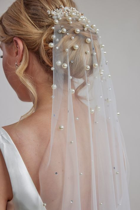 Are you looking for a veil that's both classic and stylish? Look no further! Our single-layer off-white Scattered Pearl Bridal Veil is the perfect addition to your wedding day look. Made from high-quality bridal tulle, this veil is lightweight, sparkling, and utterly romantic. Featuring a beautiful ivory blusher color and a secure comb attachment to keep it in place, this veil ensures both comfort and elegance. Designed by the talented Leah S Designs, it's a stunning choice for any bride seeking Pearled Wedding Veil, Pearl Vale, Pearl Blusher Veil, Bow Veil Wedding, Veils Bridal Hair Down, Wedding Headpiece And Veil, Fishnet Veil, Brides Veil, Wedding Veil Blusher