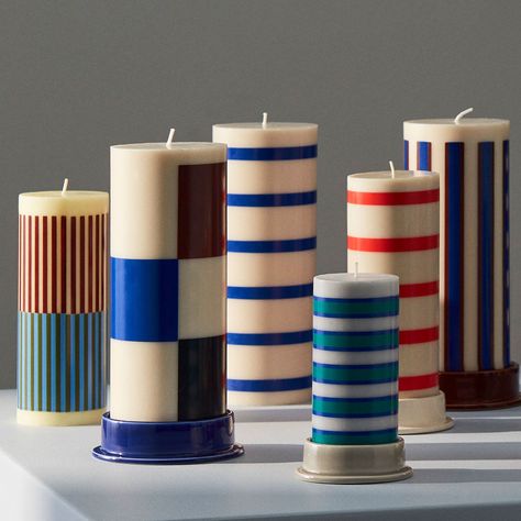 Crafted in earthenware with a semi-transparent glaze, the Column Candleholder by HAY is a low tubular design with a tempting colour palette. Designed to be used with HAY Column Candles, the minimalistic candleholder features a circular base that balances the design and catches any dripping wax. Available in different widths and colours, the candleholders can be used individually or grouped together in contrasting designs. Colourful Candles, 2026 Wedding, Flat Inspiration, Photography Set Up, Striped Candles, Cylinder Candles, Pinterest Room, Kids Room Lighting, Eye Gift