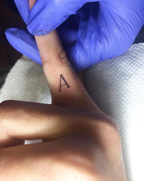 Love this tiny letter finger tattoo idea. A Finger Tattoo, A Finger Tattoo Letter, Tattoo A Letter, Finger Letter Tattoo, Finger Tattoo Letter, Letter Finger Tattoo, Letter Tattoo On Finger, Finger Tattoos Letters, K Tattoos