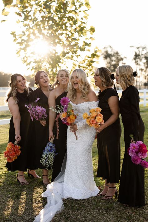 Bridal Bouquet Different From Bridesmaids, Bridesmaid One Flower Bouquet, Mix And Match Bridesmaid Bouquets, Black Bridesmaid Dresses Bright Florals, Black Bridesmaid Dresses With Colourful Flowers, One Type Of Flower Bouquet, Mixed Bridesmaid Bouquets, Black Bridesmaid Colorful Flowers, Monochrome Bridesmaid Bouquet