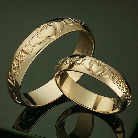 14k Gold Claddagh Wedding Rings | Men's and Women's Irish / Celtic Wedding Bands Stunning matching gold wedding bands! Handmade in Ireland and Irish Hallmarked 14k Gold in Dublin Castle. Each ring sold individually. The iconic 17th century symbol evokes love, loyalty, devotion and friendship. It echoes the words of the Irish sailor who first created this design: “With these hands I give you my heart, and I crown it with my love”. Material: 14k gold.Approx. Ring Weight: 3.1 grams for women's, 4.5 Irish Wedding Rings Unique Celtic Wedding Rings, Mens Claddagh Wedding Band, Claddagh Wedding Bands, Matching Wedding Bands His And Hers Unique, Celtic Wedding Ideas, Eclipse Wedding, Irish Wedding Dresses, Claddagh Wedding Ring, Claddagh Engagement Ring