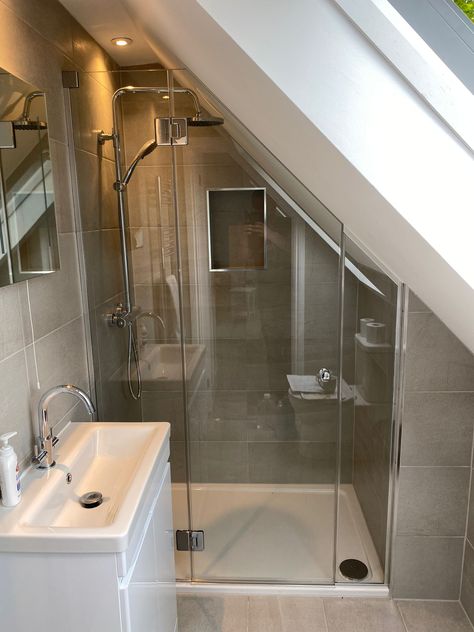 Loft And Sloping Ceiling Showers, Sloping Roof Shower Room, Small Bathroom In Eves, Tiny Bathroom Sloped Ceiling, Sloping Roof Ensuite, Small Bathroom Under Roof, Small Angled Ceiling Bathroom, Bathroom Eaves Ideas, Bath Under Sloped Ceiling