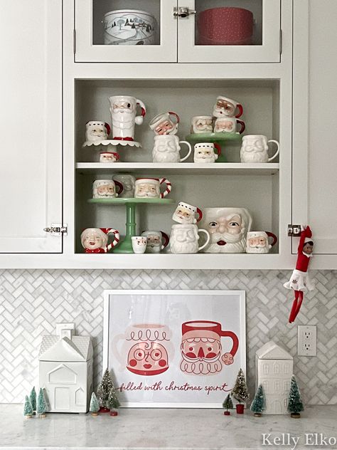 Vintage Santa Mug Art in the Kitchen - Kelly Elko Santa Mug Display Ideas, Santa Kitchen Decor, Mrs Claus Kitchen, Santa Kitchen, Art In The Kitchen, Vintage Santa Mugs Decor, Vintage Santa Mugs, Vintage White Santa Mug, Mugs Collection