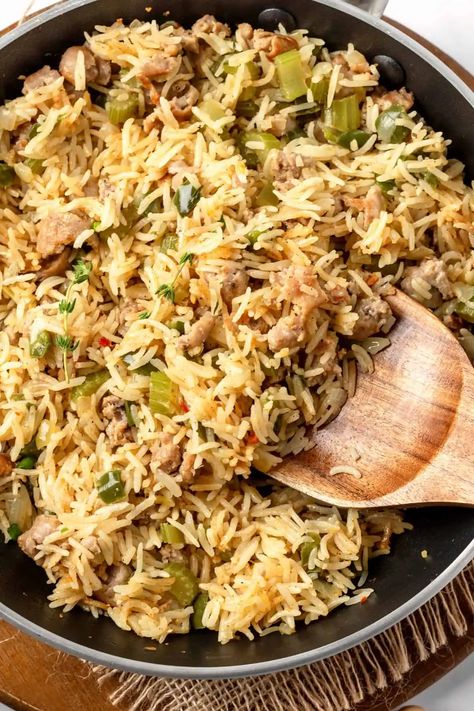 Flavorful and spicy, this easy dirty rice with sausage is perfect for a quick meal that's satisfying, filling and full of taste. Ready in under 30 minutes, this Cajun dirty rice is also totally gluten-free and dairy-free too. Best Dirty Rice Recipe, Dirty Rice With Sausage, Cajun Dinner, Rice With Sausage, Cajun Dirty Rice, Jambalaya Pasta, Dirty Rice Recipe, Yellow Rice Recipes, Cajun Dishes