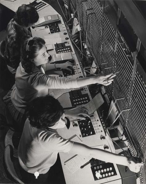 G.P.O. [General Post Office] telephone switchboard operators setting up calls to the United States at the International Exchange in the Faraday building, London, 1963. IET Archives NAEST 211/02/30/01, labelled D.5182 on verso Telephone Switchboard, International Exchange, Telephone Operator, Office Telephone, Telephone Exchange, General Post Office, Vintage Foto's, Word Cat, May I Help You