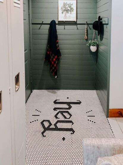 I wanted to create a unique and memorable entryway, so I wrote "HEY" in penny tile. Let me show you how to recreate this look in your own home! Drifit your penny tiles and create your art work The most important step is to drift your penny tile and experiment with your artwork by placing the contrasting tiles right on top of the base color tiles. The individual penny's pull right off the mesh backing, making them easy to work with. For this floor, I wanted to write the word "HEY". I t… Red Brick Tiles, Brick Tile Floor, Plywood Plank Flooring, Bar Backsplash, Cheap Hardwood Floors, Penny Tile Floors, Floor Makeover, Creative Tile, Hex Tile