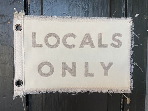 Vintage inspired cream colored canvas - camp flag LOCALS ONLY in tan/beige felt. Measures appx 12 inches long by 8 inches. Perfectly imperfect and truly one of a kind. Twill and grommets added for hanging. Vintage Surf Room Decor, Locals Only Sign, Vintage Camp Style Decor, Pennant Flag Wall Decor, Surf Style Home, Custom Pennant Flags, Vintage Pennant Flag, Camp Flag, Vintage Felt Pennants