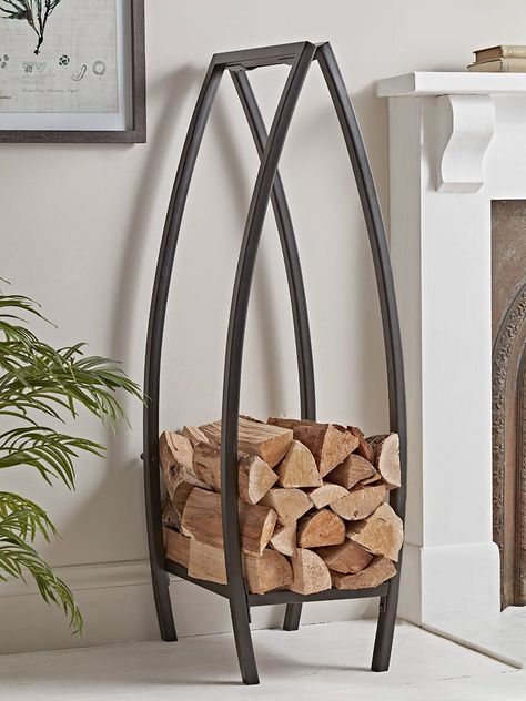 With a simple canoe shaped silhouette, our Tall Industrial Log Holder will bring a smart finishing touch to your fireside scene.The bold black iron styling makes it perfect for pairing alongside more rugged brick or stone fireplaces. It provides ample space for an evening’s worth of logs - saving chilly trips outside to the woodshed. Log Holder Fireplace, Stone Fireplaces, Outdoor Bbq Kitchen, Firewood Rack, Log Holder, Wood Store, Firewood Storage, Wood Rack, Metal Furniture Design