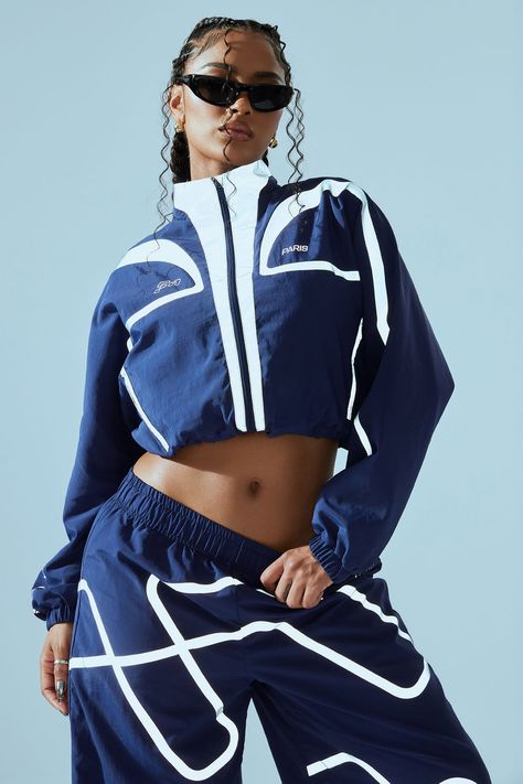 Available In Navy. Windbreaker FN Paris Verbiage Long Sleeve Front Zipper Closure 2 Zipper Pockets Reflective Trim Elastic Waistband Pair With: FN Paris Jogger Pant Self: 100% Nylon Lining: 100% Polyester Imported | FN Paris Windbreaker Jacket in Navy Blue size XS by Fashion Nova Track Suits Women Style, Tlc Fashion, Sweat Suits Women, Track Suits Women, High Waisted Pants Outfit, Navy Outfit, Womens Windbreaker, Zippered Cardigan, 90s Fashion Outfits