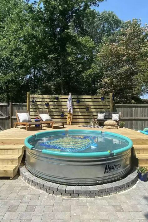 They're known as cowboy pools and trough pools and are seen everywhere! Stock tank pools are replacing more traditional in-ground swimming pools. Enjoy a look at 32 of our favorite stock tank pool designs—along with stock tank tips and how-tos—and get inspired. #StockTankPool #StockTankPoolBackyard #StockTankPoolIdeas #TheSpruce Pool Metal Tub, Small Metal Pools Backyard, Metal Tank Pool, Double Stock Tank Pool, Cowboy Pool Deck Ideas, Cowboy Swimming Pool, Water Trough Pool With Deck, Cowboy Swimming Pools, Metal Trough Pool