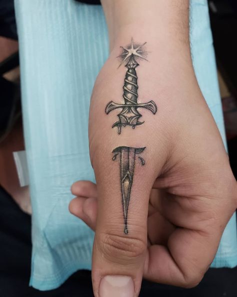 Sword finger tattoo Finger Knife Tattoo, Masculine Finger Tattoos, Knife On Finger Tattoo, Dagger Hand Tattoo, Thumb Tattoos Men, Men’s Finger Tattoos, Dagger Finger Tattoo, Finger Tattoo Swords, Small Dagger Tattoo Simple