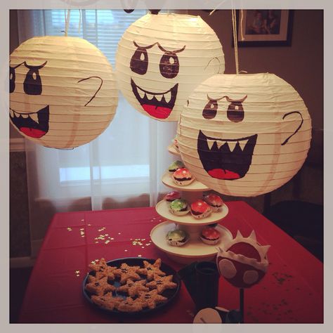 King Boo lanterns and other decorations for Mario Bros party King Boo Paper Lantern, Mario Haunted Mansion Party, Super Nintendo Party, Video Game Halloween Decorations, Mario Theme Decor, Super Mario Halloween Decorations, Nintendo Party Decorations, Mario Halloween Decorations, Mario Birthday Games