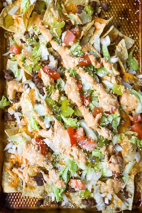 Top down view of easy homemade cheeseburger nachos with fresh lettuce and tomatoes. Big Mac Nachos Recipes, Big Mac Nachos, Cheeseburger Nachos, Cheeseburger Recipes, Nachos Recipes, Homemade Cheeseburgers, Top Down View, Recipe With Ground Beef, Cheeseburger Recipe