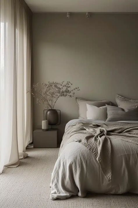 Are you tired of high-intensity hues and craving a more relaxed tone for your bedroom? Opting for a color palette combining beige and grey could be the solution you need. Here, we’ve curated 25 chic beige and grey bedroom ideas that exploit these tones' full potential, creating beautifully balanced interiors that exude tranquility and elegance. Grey Bed Room Ideas, Bedroom Taupe Walls, Calming Bedroom Colors Cozy, Cool Tone Bedroom, Grey Tone Bedroom, Grey Bed Bedroom Ideas, Grey Beige Bedroom, Bedroom Colors For 2024, Warm Grey Bedroom