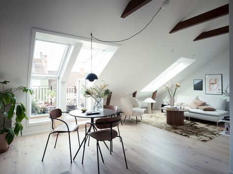 A Scandinavian attic loft of only 34sq. meter looks a lot bigger thanks to the light color scheme ... Attic Studio Apartment, Scandinavian Loft, Glass Room Divider, Dark Grey Kitchen, Attic Loft, Scandinavian Apartment, Attic Apartment, Glass Room, Stylish Apartment