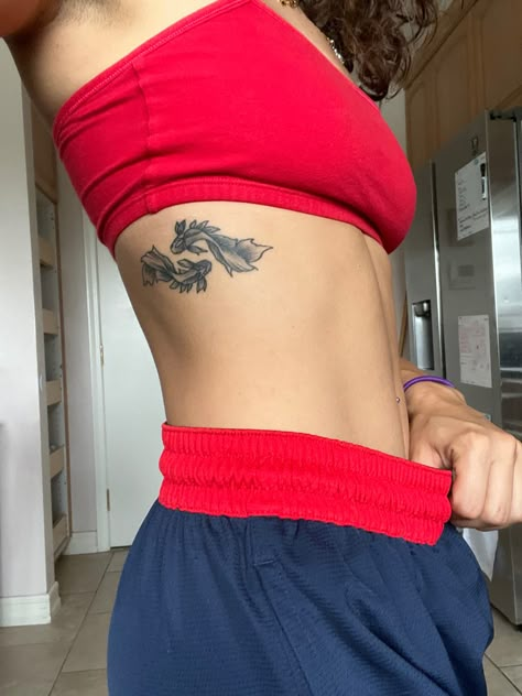 Koi Fish Tattoo On Waist, Koi Fish Tattoo Rib Cage, Koi Fish Tattoo Placement Ideas, Yin And Yang Coy Fish Tattoo, Koi Fish Hip Tattoos Women, Koi Fish Tattoo On Ribs, Koi Fish Tattoo Side Ribs, Koi Rib Tattoo, Koi Fish Stomach Tattoo