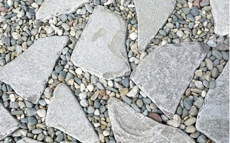 The 15 Most Unique Paver Patio Ideas of 2023 | REthority Unique Paver Patio Ideas, Patio With Rocks And Pavers, Paver And Stone Patio, Rock And Paver Patio Ideas, River Stone Patio, Unique Paver Designs, Flat Rock Patio, Pavers With Rocks In Between, Rock Patio Ideas