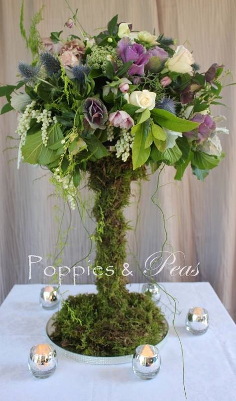 Enchanted Sweet 16 Centerpieces, Enchanted Forest Centerpiece Ideas, Enchanted Forest Table Centerpieces, Secret Garden Centerpieces, Enchanted Garden Quinceanera Theme, Enchanted Forest Centerpieces Diy, Fake Moss Crafts, Fairy Garden Centerpiece Ideas, Fairy Centre Pieces