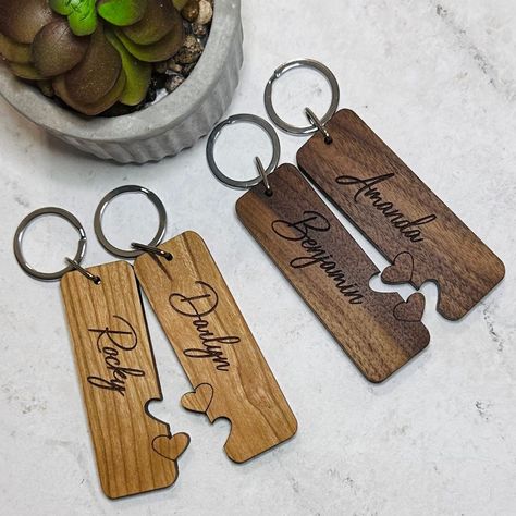 "These beautiful, solid wood keychains make a great gift for a couple.  Perfect for wedding, anniversary, Valentine's Day, or just to show the love between two people.  Keychains are custom cut and laser engraved.  Keychains are 1\" wide by 3\" long, made of 1/4\" solid hardwood.   Please choose type of wood, and add names (double check spelling and capitalization) in the personalization area. Due to the natural variations in wood, they may not appear exactly as shown in the listing photos." Wood Projects For Couples, Laser Engraving Ideas Valentines, Valentine’s Day Wood Projects, Valentines Engraving Ideas, Valentine's Day Laser Cut Gifts, Valentines Day Laser Engraving Ideas, Wood Valentines Gifts, Valentine Laser Ideas, Laser Engraved Valentines Gifts