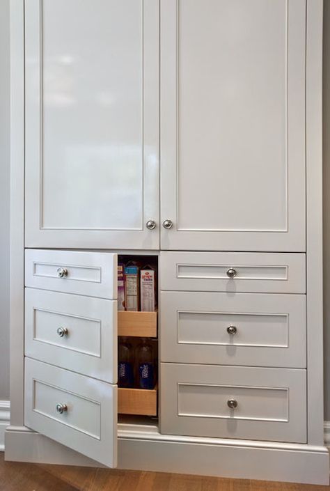 Lovely kitchen features built-in pantry cabinets stacked over cabinet doors disguised as drawers opening to reveal pull-out pantry shelves. Pantry Pull Out Drawers, Kitchen Pantry Doors, Pantry Drawers, Closet Built Ins, Built In Pantry, Hallway Cabinet, Cabinet With Drawers, Diy Pantry, Kitchen Pantry Cabinets