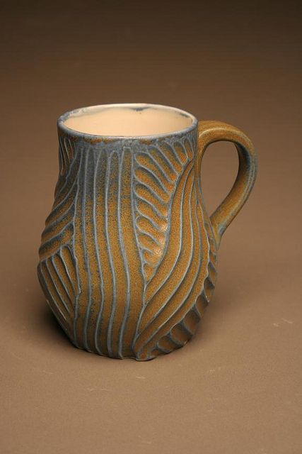 from Twisted Terra, ceramic site for clay artists - love the design and glaze Ceramic Mugs Shapes, Ceramic Mug Texture, Clay Surface Design, Ceramic Surface Texture, Clay Carving Designs Pattern, Textured Ceramic Mugs, How To Carve Pottery, Slip Carving Pottery, Surface Design Ceramics