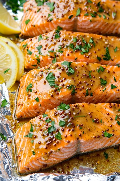 Try this delicious recipe for Honey Mustard Baked Salmon tonight! This easy-to-make dish is bursting with flavor and is perfect for a quick weeknight dinner or special occasion. The combination of sweet honey and tangy mustard creates a mouthwatering glaze that perfectly complements the tender salmon fillets. Simply mix together the honey, mustard, and some herbs, brush over the salmon, then bake until golden brown and cooked through. Baked Salmon Mustard, Whole Grain Mustard Salmon, Salmon Mustard Recipes, Salmon Recipes With Honey, Mustard Salmon Recipes, Dijon Mustard Salmon, Honey Dijon Salmon, Whole Salmon Recipe, Honey Butter Salmon