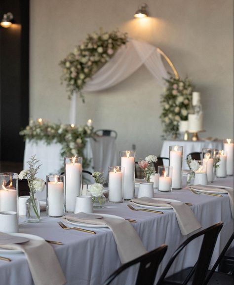 #event #wedding #aesthetic #white #rental #candles #peony #arch Wedding Arch Black, Antique Centerpieces, Simple Indoor Wedding, Floral Sweetheart Table, Indoor Wedding Arch, White Wedding Arch, Sand Candles, Family Owned Business, Aesthetic White