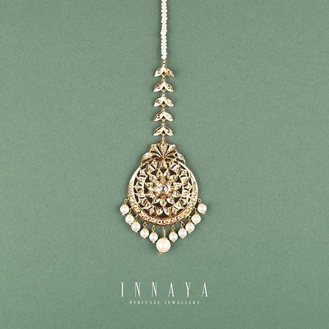 LOTUS TIKKA INNAYA HERITAGE JEWELLERY Structured silver jhumka with freshwater pearl detailing plated in 22carat gold Email or DM for price details info@innayaheritagejewellery.com #innayaheritagejewellery #heritage #jewellery #oldworldcharm #gigihadid #gigi #voguegermany #choker #weddings #desibrides #zaynmalik #zayn #collage #art #fahadhussayn #pakistanstyle #earings #jewelleryblogger #vogue #vintage #love #style #bride #wedding #desiwedding #desibrides #follow Diwali Temple Jewelry Tikka With Jeweled Detail, Gold Tilla Tikka For Puja, Festival Gold Plated Temple Jewelry Tikka, Elegant Handmade Gold Tikka, Gold Jeweled Bollywood Tikka, Tika Jewelry, Tikka Jewelry, Jewelry Diy, Silver Jewelry Cleaner