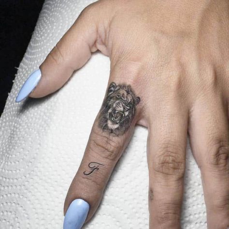 Lion Finger Tattoo 1 Leo Female Tattoo, Tattoos For Women Lion, Small Lion Tattoo For Women, Lion Tattoo For Women, Colorful Lion Tattoo, Lion And Rose Tattoo, Lion Tattoo On Finger, Lion Sleeve, Lion Hand Tattoo