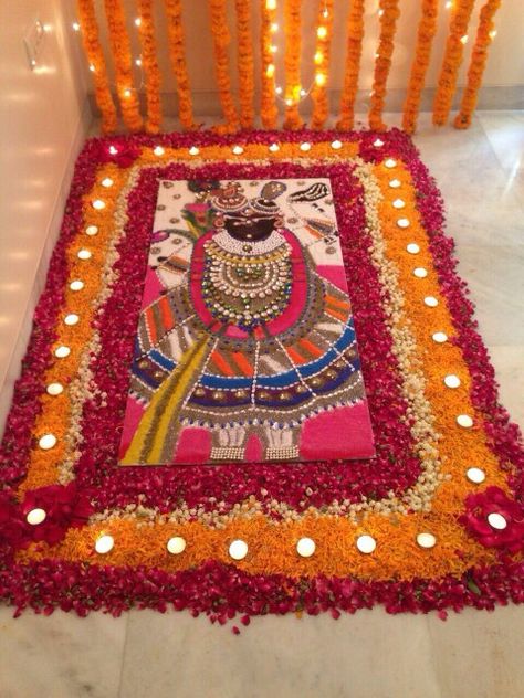 With fresh flowers Goverdhan Pooja Rangoli, Shrinathji Rangoli Designs, Pichwai Rangoli Designs, Rangoli For Competition Unique, Goverdhan Maharaj, Shreenathji Rangoli Design, Balaji Rangoli, Shreenathji Rangoli, Rangoli God