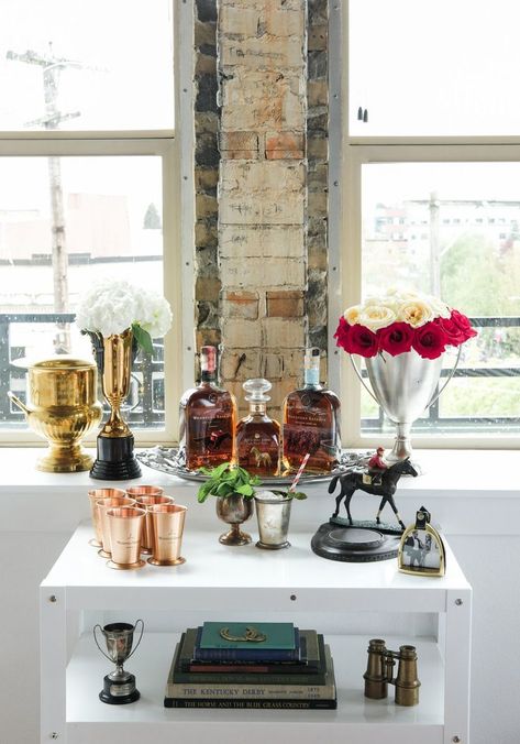 Kentucky Derby Party inspiration. Mint Julep bar cart. Trophy cup vase, Woodford Reserve bourbon, vintage Kentucky Derby books, equestrian home decor. Kentucky Derby Mens Attire, Kentucky Derby Decor, Vintage Kentucky Derby, Kentucky Derby Themed Party, Equestrian Home Decor, Mint Julep Bar, Kentucky Derby Party Food, Equestrian Home, Kentucky Derby Wedding