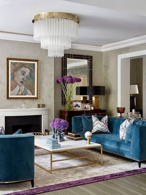 BEAUTIFUL ART DECO HOME DECOR IDEAS by Lifestyle and Home Decor Blogger Laura Lily, blue velvet couch, art deco design, tiered chandelier, art deco mirror, marble and gold coffee table, purple cream rug, art deco design, art deco inspired, geometric mirror, art deco mantel, Teal Living Room Decor, Black Couch, Teal Living Rooms, Art Deco Living Room, Couch Decor, Room Black, Trendy Living Rooms, Interior Deco, Room Decorations