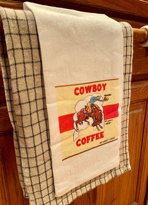 "We love this CoWbOy Coffee tin label kitchen towel! Boasting coffee with a \"Kick\"! Great gift giving idea!  MADE IN THE USA! 100% Cotton flour Feedsack fabric, comes with a j hook for easy hanging! Measures: 17\" x 24\"" Cowgirl Kitchen Decor, Cottage Western Home, Small Western Kitchen Ideas, Cowboy Apartment, Western Farmhouse Kitchen, Western Kitchen Ideas, Western Apartment Decor, Cowgirl Kitchen, Cowboy Cottage