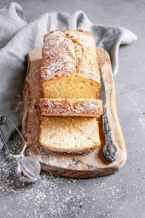 This triple coconut cake is soft, tender and is all about the coconut flavor and texture. #coconut #coconutcake #coconutrecipe #coconutcakerecipe #recipe #recipecake #coconutcakefromscratch #oldfashioncake #oldfashioncoconutcake #easycoconutcake #coconutrecipeidea #poundcake #loafcake #loafcakephotography onesarcasticbaker.com| Coconut Cake From Scratch, Coconut Loaf Cake, Coconut Loaf, Breakfast Potluck, Loaf Breads, Cooking Desserts, Lemon And Coconut Cake, Cheesecake Oreo, Dessert Cakes