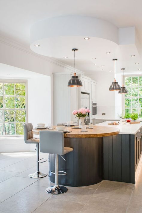 Introduce some curvature to your kitchen space with a curved kitchen island. Curves add instant character to a space, with those sleek lines that are perfectly formed, creating a soft, and gorgeous aesthetic. ✨ Featuring our Modern Shaker Kitchen Design with a blue panelled kitchen island seperated by a circular Oak countertop and a White Quartz Worktop. Kitchen Island With Round Table, Curved Kitchen Islands, Kidney Shaped Kitchen Island, Island With Round Table Attached, Curved Island Countertop, Round Island Table, Shaped Kitchen Island, Circular Kitchen Island With Seating, Round End Kitchen Island